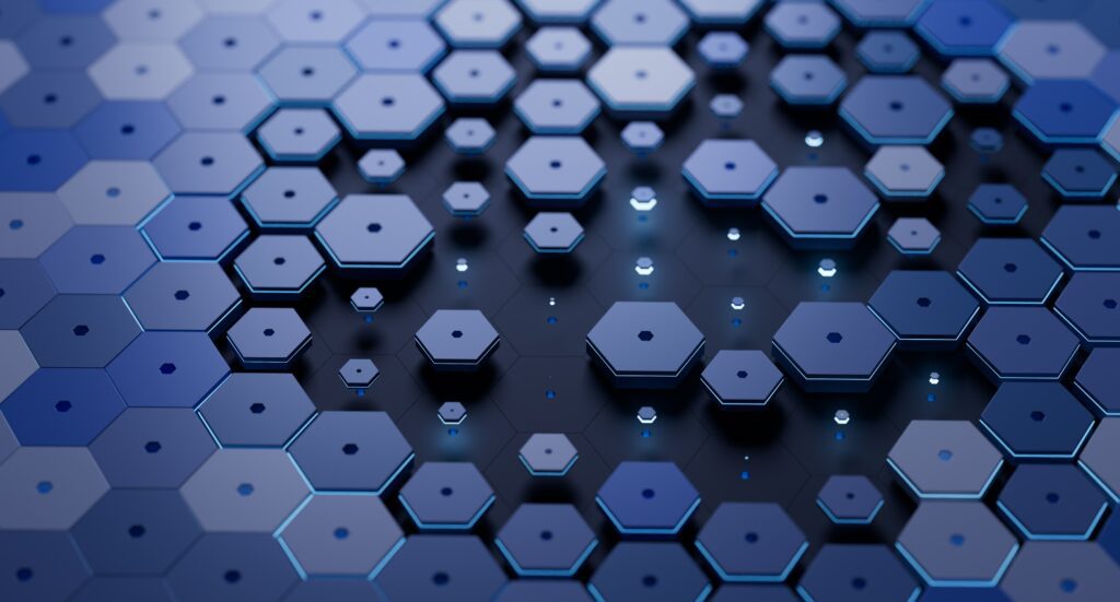 A grid of dark blue hexagons that fit together like a puzzle on the edges. In the middle, the hexagons are spread apart, vary in size, and float above a darker blue background. All the hexagons have a small hexagon pattern punched out of the center. This image represents our Free Software Architecture Integration Review.