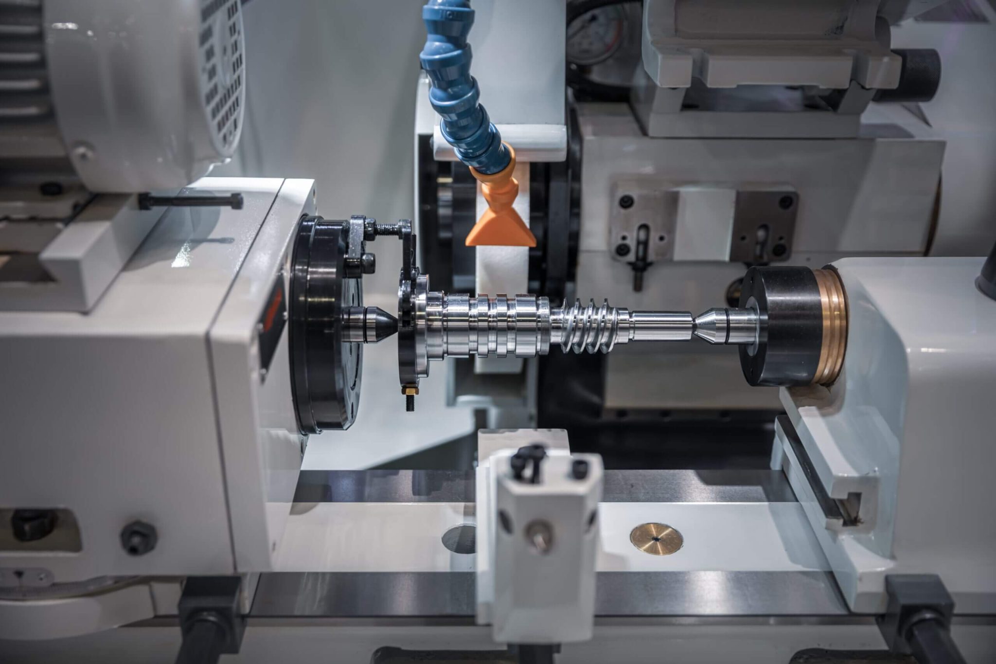 Close-up of a CNC machine used for metalworking or in a milling process. This represents Work Horse as an IT business process & workflow automation company for small to large manufacturers and service companies.
